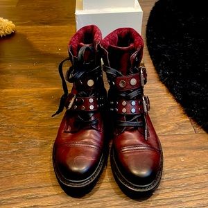 Frye hiking boots.  Cordovan leather with studded straps that snap on the side.
